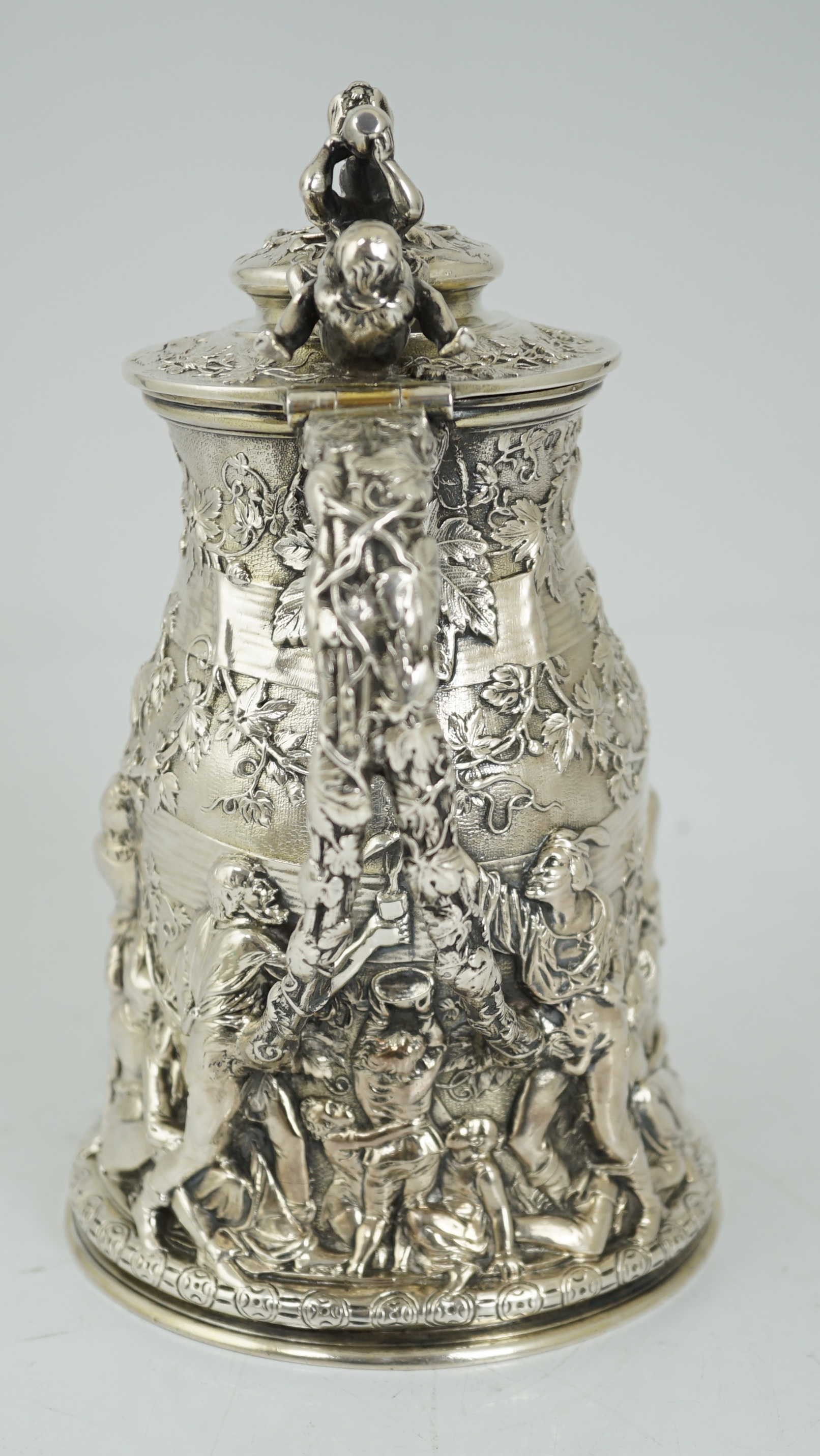 ROYAL INTEREST: A good ornate Victorian Teniers style silver ewer with hinged cover by Frederick Elkington